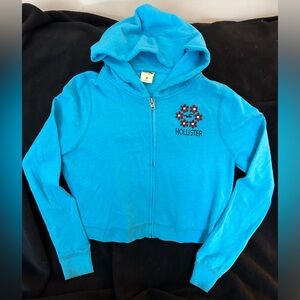 Hollister Turquoise Zip Up Hoodie with Red Floral Design